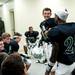 Father Gabriel Richard varsity football players smile in the locker room at halftime on Saturday. The score at half was 17-3. Daniel Brenner I AnnArbor.com